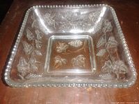 Top view of square glass bowl showing grape relief pattern and beaded rim