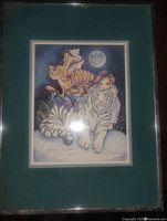Framed print with teal mat and glass showing tiger illustration