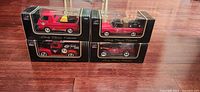 Four boxed die-cast Canadian Tire pickup trucks front view