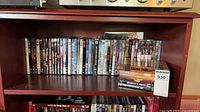 Full view of shelf showing majority of DVD spines and small stack of box sets