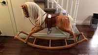side view of full rocking horse on curved rocker base