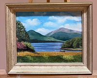 Front view of framed landscape painting