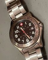 Front view of watch showing dial, bezel, hands and numerals