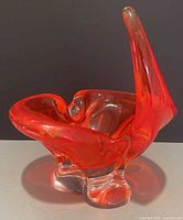Overall view showing orange and clear chalet art glass bowl front angle