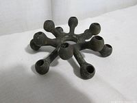 Top view of cast iron spider candle holder
