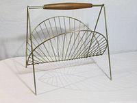 Front view showing half-moon wire panels and A-frame legs