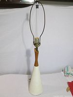 Full view showing complete lamp with harp and finial