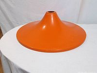 Side view showing orange exterior conical form