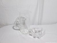 Pitcher and bowl side by side