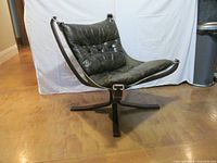 Front view of Falcon chair showing bentwood frame, sling, cushion