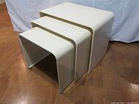 Angled view of all three nesting tables stacked