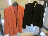 Front view of both blazers hanging