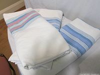 All three flannel sheets folded, showing stripe patterns