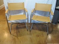 Front view of both chrome cantilever armchairs