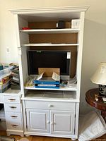 Front view showing overall structure, shelves, TV compartment and lower cabinet