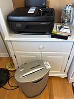 HP printer on cabinet with shredder below