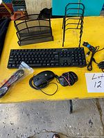 All items displayed: keyboard, two mice, two letter racks, cables