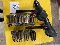 All items: 9 pedal pairs and 2 Hyper seats on yellow surface