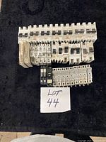 Top view of all breakers and fuse holders laid out on black surface