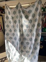 Curtain panel hung to show pattern, grommet top and overall size