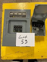 Square D load center and Mars disconnect side by side with lot card visible