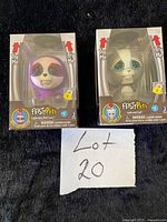 Both boxed Feisty Pets figures visible