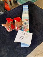 Boxed Artist's Loft paint by number kit and pair of reindeer slippers on dark cloth