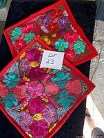 Front view of both floral embroidered pillow shams