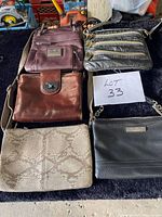 Five purses laid flat showing fronts, colors, styles, and note LOT 33