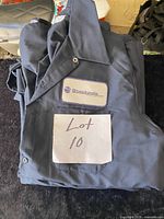 Folded navy work shirt with Stackpole name patch