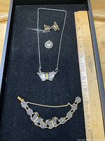 Entire set laid out with ruler for scale