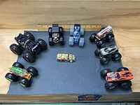 All nine vehicles arranged on mat