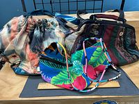 All three purses front view with ruler for scale