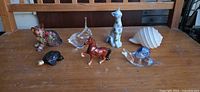 Group shot displaying all seven animal figurines on tabletop