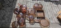 Full collection of amber glass cookware laid out on deck