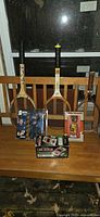 Overall lot with three rackets, card shuffler box, bobblehead and action figure