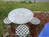 patio set overview showing table and four of five chairs