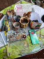 overview of all hardware, containers and drill bits on table