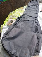 Full view of black guitar bag front side