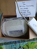 Design Concepts laminator in bubble wrap and Bedazzler handheld tool in box