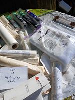 Overview of bagged fusible fleece and multiple stabilizer rolls on table