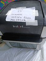 Front and top view of Instant Vortex Plus air fryer oven showing branding