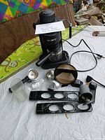 Overall view of coffee maker and accessories laid out