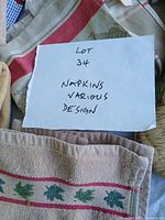Group view of assorted towels and napkins with lot note