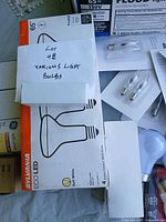 Overview showing Sylvania Eco LED 4-pack and multiple blister-pack chandelier bulbs