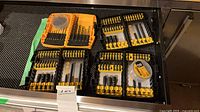 Overview of five DeWalt cases and two round bit pods