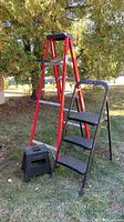All three items: red 6-ft step ladder, black 3-ft step ladder, black folding foot stool