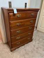 Full front view of pine highboy showing five drawers and hardware