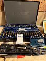 Overall lot showing tap & die set open with contents, drafting set and micrometer cases