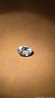 Loose light-blue oval aquamarine on surface
